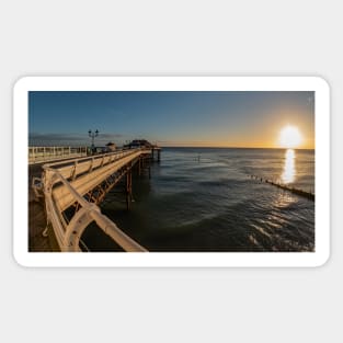 Fisheye view along Cromer Pier at sunrise Sticker